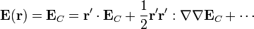 \mathbf{E}(\mathbf{r})=\mathbf{E}_C = \mathbf{r}'\cdot\mathbf{E}_C+\frac{1}{2}\mathbf{r}'\mathbf{r}':\nabla\nabla\mathbf{E}_C + \cdots