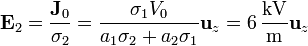 \mathbf{E}_2 = \frac{\mathbf{J}_0}{\sigma_2} = \frac{\sigma_1V_0}{a_1\sigma_2+a_2\sigma_1}\mathbf{u}_z = 6\,\frac{\mathrm{kV}}{\mathrm{m}}\mathbf{u}_z